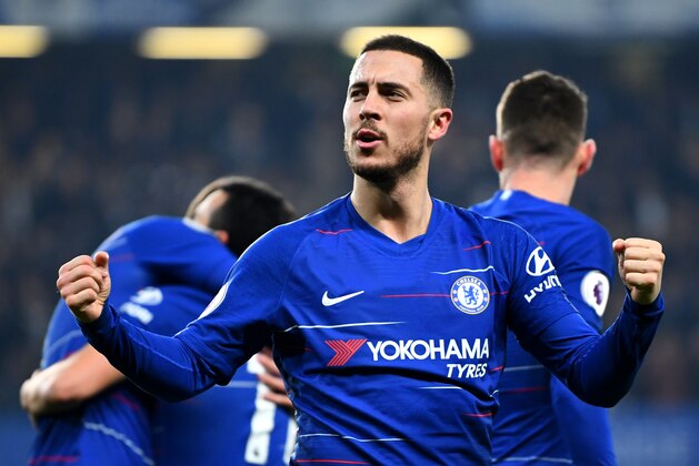 LONDON, ENGLAND - FEBRUARY 27: Eden Hazard of Chelsea celebrates as Pedro of Chelsea scores their first goal during the Premier League match between Chelsea FC and Tottenham Hotspur at Stamford Bridge on February 27, 2019 in London, United Kingdom. (Photo by Clive Mason/Getty Images)