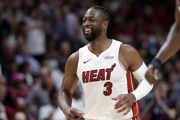 Miami Heat guard Dwyane Wade (3) smiles after scoring during the second half of an NBA basketball game against the Boston Celtics, Wednesday, April 3, 2019, in Miami. The Celtics won 112-102. (AP Photo/Lynne Sladky)