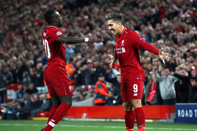 LIVERPOOL, ENGLAND - APRIL 09: Roberto Firmino of Liverpool celebrates after scoring his team's second goal with Sadio Mane of Liverpool during the UEFA Champions League Quarter Final first leg match between Liverpool and Porto at Anfield on April 09, 2019 in Liverpool, England. (Photo by Julian Finney/Getty Images)