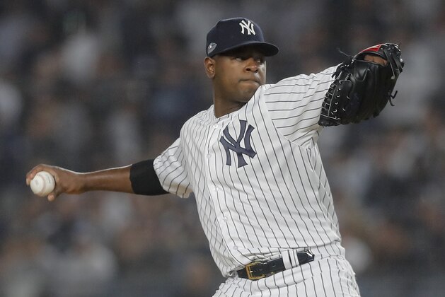 FILE - In this Oct. 8, 2018, file photo, New York Yankees starting pitcher Luis Severino delivers against the Boston Red Sox during the first inning of Game 3 of baseball's American League Division Series in New York. AL MVP Mookie Betts, NL Cy Young Award winner Jacob deGrom and major league home run champion Khris Davis reached high-priced one-year deals to avoid salary arbitration, while slugger Nolan Arenado and pitchers Gerrit Cole, Severino and Aaron Nola failed to reach agreements and for now appeared headed to hearings. (AP Photo/Julie Jacobson, File)