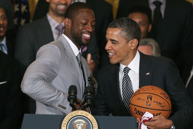 WASHINGTON, DC - JANUARY 28:  Miami Heat player Dwyane Wade (C) shakes hands with President Barack Obama (R) during an event to honor the NBA champion Miami Heat in the East Room at the White House on January 28, 2013 in Washington, DC. President Barack Obama congratulated the 2012 NBA champions for claiming their third NBA Championship by beating the Boston Celtics.  (Photo by Mark Wilson/Getty Images)