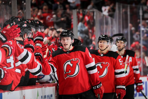 NEWARK, NEW JERSEY - APRIL 01:  Joey Anderson #49 of the New Jersey Devils celebrates his empty net goal with teammates on the bench in the third period against the New York Rangers at Prudential Center on April 01, 2019 in Newark, New Jersey. (Photo by Elsa/Getty Images)