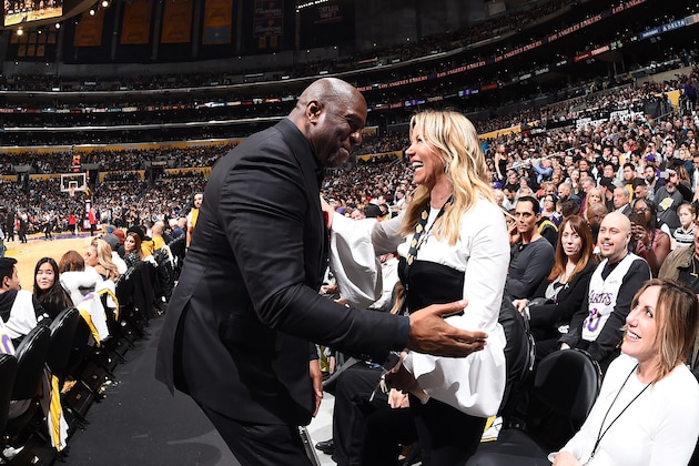 LOS ANGELES, CA - MARCH 11:  Magic Johnson and Jeanie Buss exchange a hug during the game between the Los Angeles Lakers and Cleveland Cavaliers on March 11, 2018 at STAPLES Center in Los Angeles, California. NOTE TO USER: User expressly acknowledges and agrees that, by downloading and/or using this Photograph, user is consenting to the terms and conditions of the Getty Images License Agreement. Mandatory Copyright Notice: Copyright 2018 NBAE (Photo by Andrew D. Bernstein/NBAE via Getty Images)