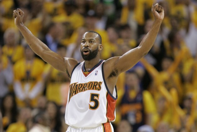 FILE - In this May 3, 2007, file photo, Golden State Warriors' Baron Davis celebrates after scoring against the Dallas Mavericks during the second half of a NBA Western Conference first-round playoff basketball game at Oracle Arena, in Oakland, Calif. The Warriors are playing their final season at Oracle Arena and will be moving to Chase Center in San Francisco, in 2019. (AP Photo/Marcio Jose Sanchez, File)
