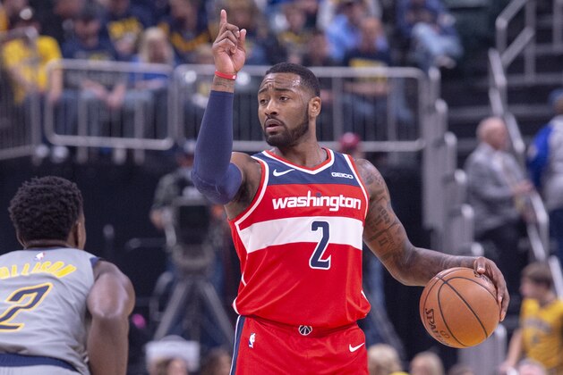 Washington Wizards guard John Wall (2) brings the ball up court during an NBA basketball game, Sunday, Dec. 23, 2018, in Indianapolis. Indiana Pacers won, 105-89. (AP Photo/Doug McSchooler)