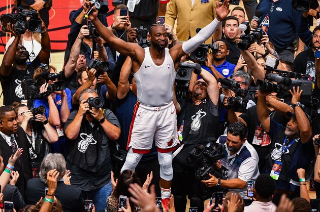 MIAMI, FL - APRIL 09: Dwyane Wade #3 of the Miami Heat runs on top of the scorers table to thank the fans after the final regular season home game of his career against the Philadelphia 76ers at American Airlines Arena on April 09, 2019 in Miami, Florida. NOTE TO USER: User expressly acknowledges and agrees that, by downloading and or using this photograph, User is consenting to the terms and conditions of the Getty Images License Agreement.  (Photo by Mark Brown/Getty Images)