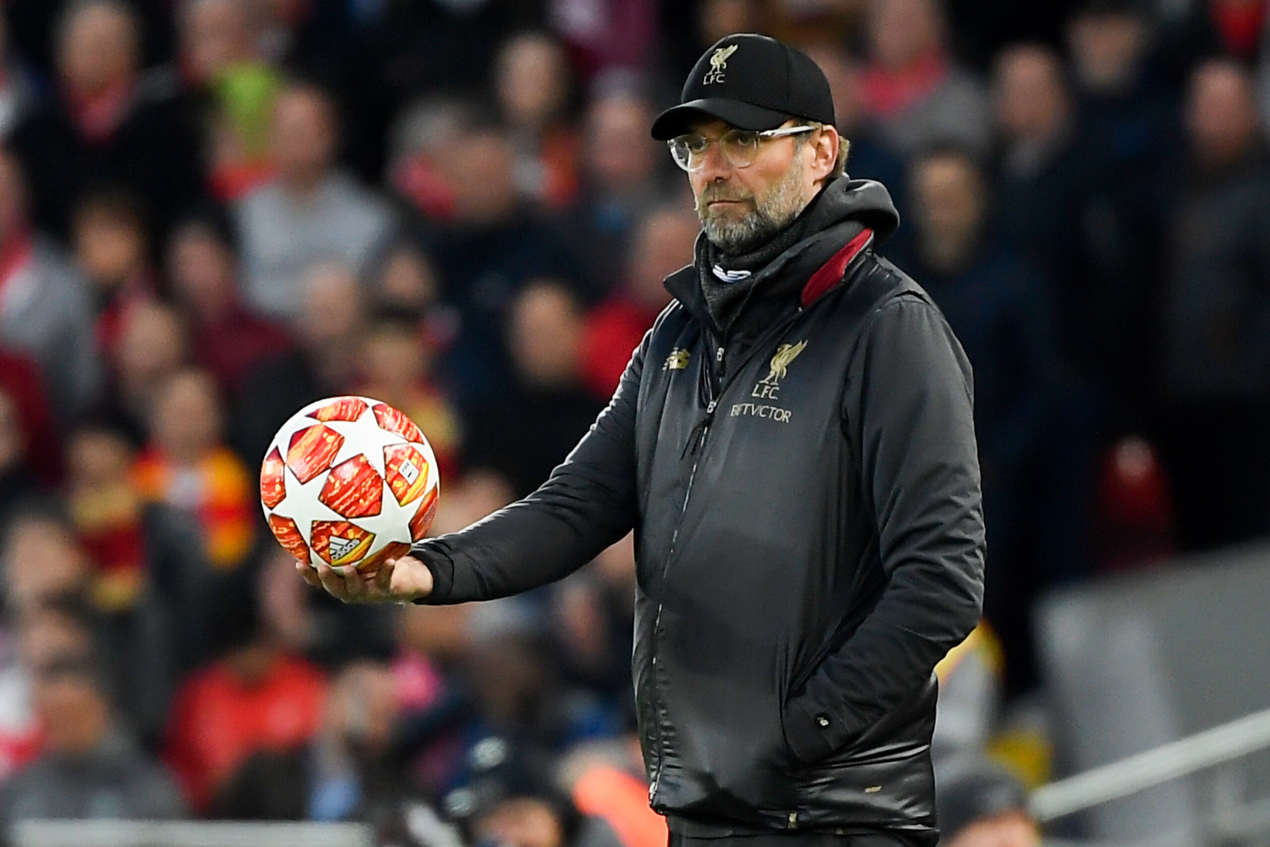Liverpool's German manager Jurgen Klopp holds the ball as he looks on during the UEFA Champions League quarter-final, first leg football match between Liverpool and FC Porto at Anfield stadium in Liverpool, north-west England on April 9, 2019. (Photo by LLUIS GENE / AFP)        (Photo credit should read LLUIS GENE/AFP/Getty Images)