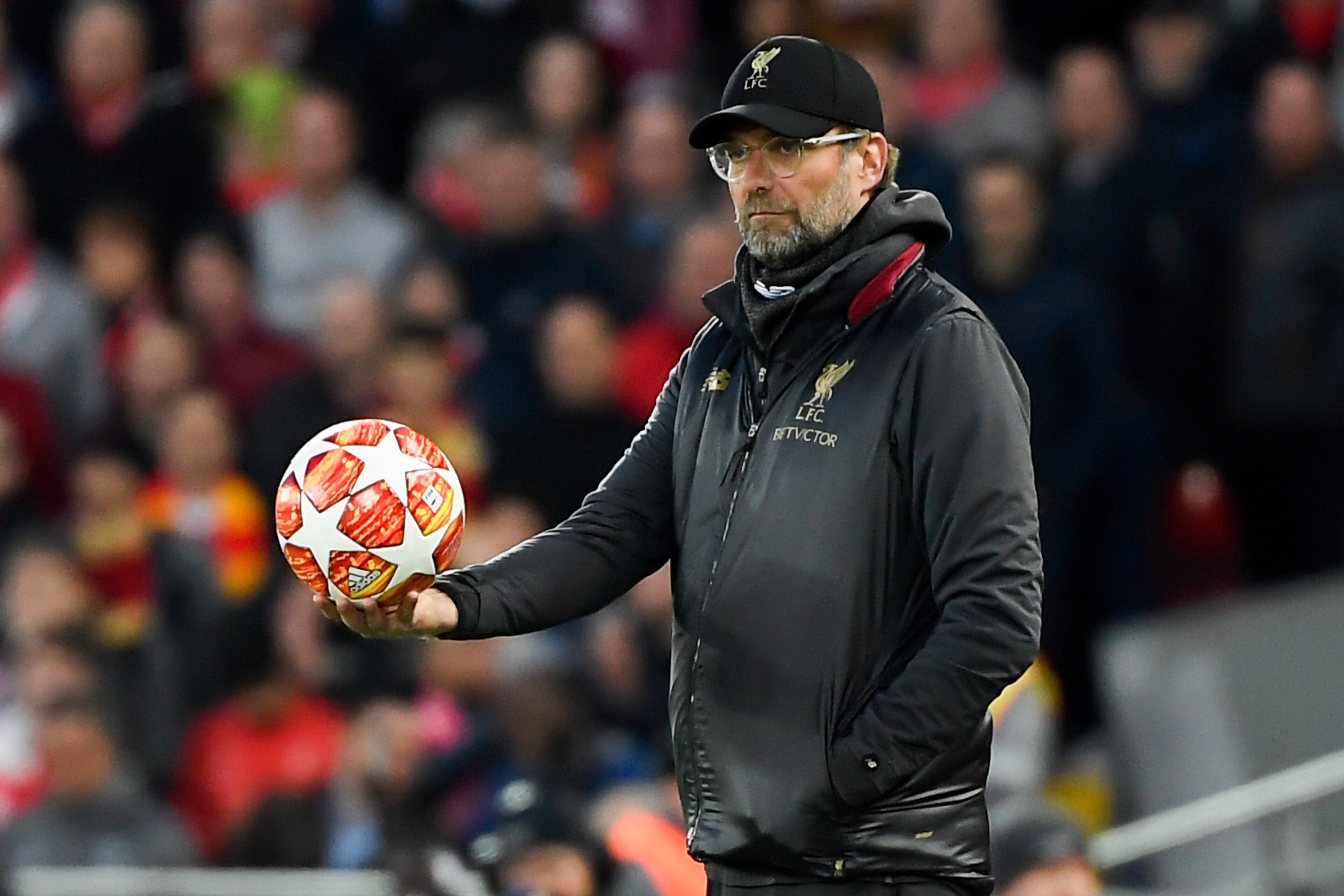 Liverpool's German manager Jurgen Klopp holds the ball as he looks on during the UEFA Champions League quarter-final, first leg football match between Liverpool and FC Porto at Anfield stadium in Liverpool, north-west England on April 9, 2019. (Photo by LLUIS GENE / AFP)        (Photo credit should read LLUIS GENE/AFP/Getty Images)