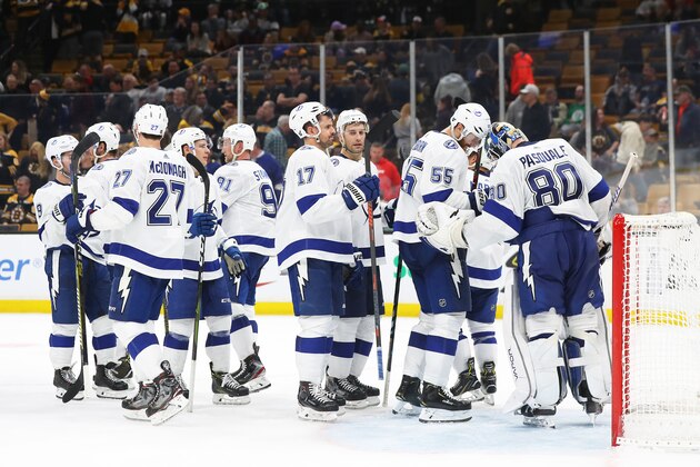 BOSTON, MASSACHUSETTS - APRIL 06: Members of the Tampa Bay Lightning celebrate with Edward Pasquale #80 after their 6-3 win over the Boston Bruins at TD Garden on April 06, 2019 in Boston, Massachusetts. (Photo by Maddie Meyer/Getty Images)