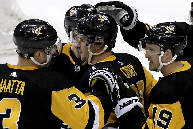 Pittsburgh Penguins' Sidney Crosby, center, celebrates after scoring during the first period of an NHL hockey game against the New York Rangers in Pittsburgh, Saturday, April 6, 2019. (AP Photo/Gene J. Puskar)