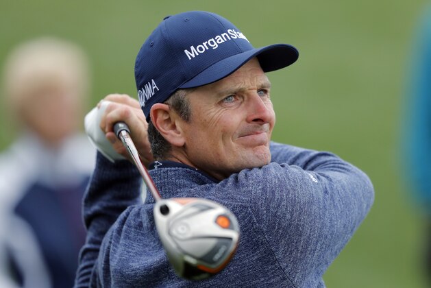 Justin Rose, of England, tees off on the 18th hole during the final round of The Players Championship golf tournament Sunday, March 17, 2019, in Ponte Vedra Beach, Fla. (AP Photo/Gerald Herbert)