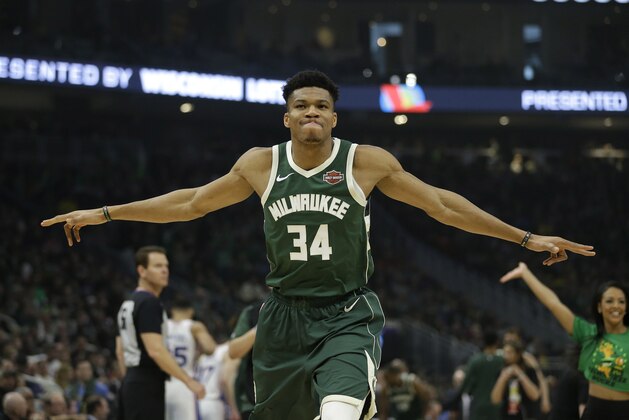 Milwaukee Bucks' Giannis Antetokounmpo stretches before an NBA basketball game against the Philadelphia 76ers Sunday, March 17, 2019, in Milwaukee. (AP Photo/Aaron Gash)