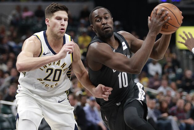 Brooklyn Nets forward Theo Pinson (10) drives past Indiana Pacers forward Doug McDermott in the second half of an NBA basketball game, Saturday, Oct. 20, 2018, in Indianapolis. Indiana won 132-112. (AP Photo/R Brent Smith)