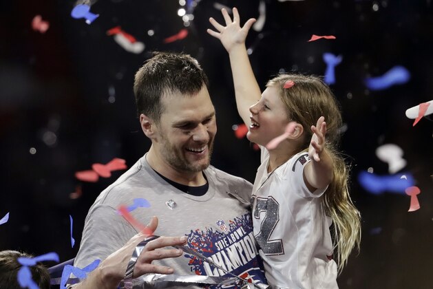 New England Patriots' Tom Brady holds his daughter, Vivian, after the NFL Super Bowl 53 football game against the Los Angeles Rams, Sunday, Feb. 3, 2019, in Atlanta. The Patriots won 13-3. (AP Photo/Jeff Roberson)