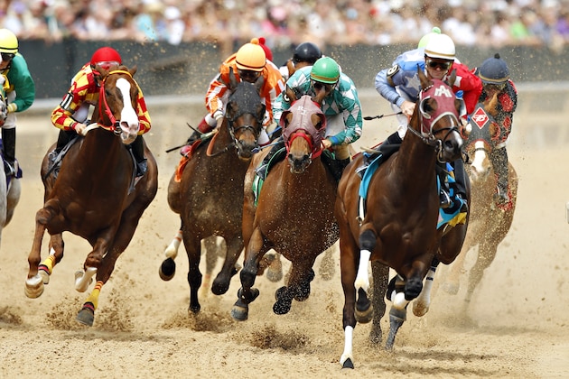 HOT SPRINGS, AR - APRIL 14:   Horses round the first turn during Race #3 at Oaklawn Park during the Racing Festival of The South on April 14, 2012 in Hot Springs, Arkansas.    (Photo by Wesley Hitt/Getty Images)