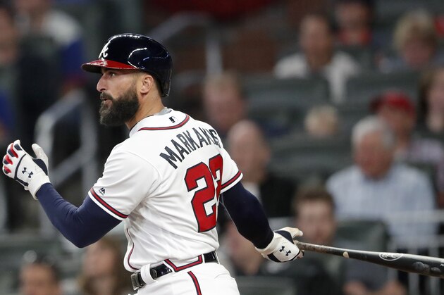 Atlanta Braves right fielder Nick Markakis (22) bats against the Chicago Cubs during baseball game Wednesday, April 3, 2019, in Atlanta. (AP Photo/John Bazemore)