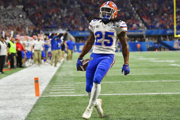 Florida running back Jordan Scarlett (25) runs into the end zone for a touchdown against Michigan during the first half of the Peach Bowl NCAA college football game, Saturday, Dec. 29, 2018, in Atlanta. (AP Photo/Mike Stewart)