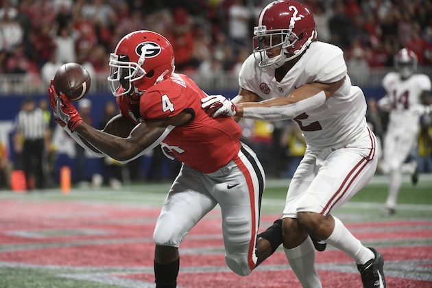 Georgia wide receiver Mecole Hardman (4) misses the catch in the end zone against Alabama defensive back Patrick Surtain II (2) during the first half of the Southeastern Conference championship NCAA college football game, Saturday, Dec. 1, 2018, in Atlanta. (AP Photo/John Amis)