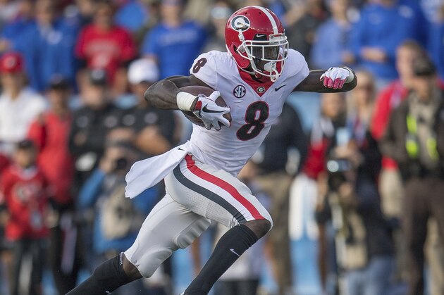 Georgia wide receiver Riley Ridley (8) runs with the ball during the first half an NCAA college football game against Kentucky in Lexington, Ky., Saturday, Nov. 3, 2018. (AP Photo/Bryan Woolston)