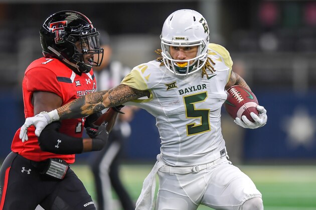 LUBBOCK, TX - NOVEMBER 24: Wide receiver Jalen Hurd #5 of the Baylor Bears tries to get past defensive back Jah'Shawn Johnson #7 of the Texas Tech Red Raiders during the first half of the game on November 24, 2018 at  AT&T Stadium in Arlington, Texas. (Photo by John Weast/Getty Images)