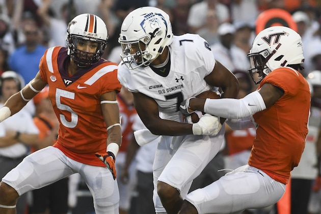 BLACKSBURG, VA - SEPTEMBER 22: Defensive back Khalil Ladler #9 of the Virginia Tech Hokies attempts to rip the ball from wide receiver Travis Fulgham #7 of the Old Dominion Monarchs following his reception in the second half at S. B. Ballard Stadium on September 22, 2018 in Norfolk, Virginia. (Photo by Michael Shroyer/Getty Images)