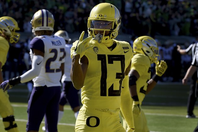 EUGENE, OR - OCTOBER 13: Wide receiver Dillon Mitchell #13 of the Oregon Ducks celebrates after scoring a touchdown during the first quarter of the game against the Washington Huskies at Autzen Stadium on October 13, 2018 in Eugene, Oregon.  (Photo by Steve Dykes/Getty Images)