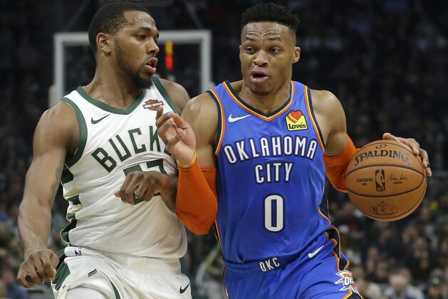 Oklahoma City Thunder's Russell Westbrook drives to the basket against Milwaukee Bucks' Sterling Brown during the first half of an NBA basketball game Wednesday, April 10, 2019, in Milwaukee. (AP Photo/Aaron Gash)