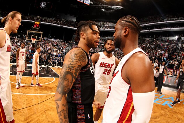 BROOKLYN, NY - APRIL 10: D'Angelo Russell #1 of the Brooklyn Nets and Dwyane Wade #3 of the Miami Heat hug before the game on April 10, 2019 at Barclays Center in Brooklyn, New York. NOTE TO USER: User expressly acknowledges and agrees that, by downloading and or using this Photograph, user is consenting to the terms and conditions of the Getty Images License Agreement. Mandatory Copyright Notice: Copyright 2019 NBAE (Photo by Issac Baldizon/NBAE via Getty Images)