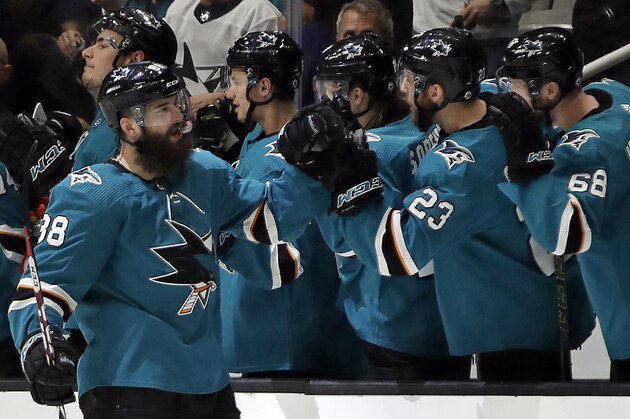 San Jose Sharks' Brent Burns, left, is congratulated for his goal against the Vegas Golden Knights during the second period of Game 1 of an NHL hockey first-round playoff series Wednesday, April 10, 2019, in San Jose, Calif. (AP Photo/Ben Margot)
