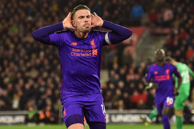 Liverpool's English midfielder Jordan Henderson celebrates after scoring their third goal during the English Premier League football match between Southampton and Liverpool at St Mary's Stadium in Southampton, southern England on April 5, 2019. (Photo by Glyn KIRK / AFP) / RESTRICTED TO EDITORIAL USE. No use with unauthorized audio, video, data, fixture lists, club/league logos or 'live' services. Online in-match use limited to 120 images. An additional 40 images may be used in extra time. No video emulation. Social media in-match use limited to 120 images. An additional 40 images may be used in extra time. No use in betting publications, games or single club/league/player publications. /         (Photo credit should read GLYN KIRK/AFP/Getty Images)
