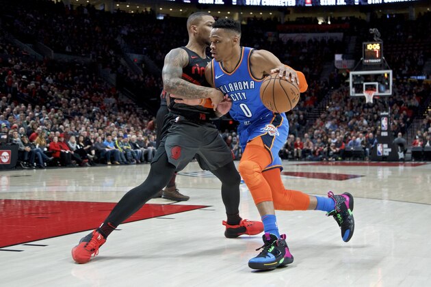 Oklahoma City Thunder guard Russell Westbrook, right, drives Portland Trail Blazers guard Damian Lillard during the first half of an NBA basketball game in Portland, Ore., Thursday, March 7, 2019. (AP Photo/Craig Mitchelldyer)