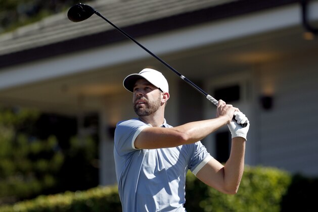 Kevin Tway plays his shot from the first tee during the final round of the Tournament of Champions golf event, Sunday, Jan. 6, 2019, at Kapalua Plantation Course in Kapalua, Hawaii. (AP Photo/Matt York)