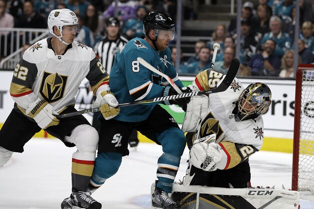 San Jose Sharks' Joe Pavelski (8) reacts after scoring a goal against Vegas Golden Knights goalie Marc-Andre Fleury, right, during the first period of Game 1 of an NHL hockey first-round playoff series Wednesday, April 10, 2019, in San Jose, Calif. At left is Golden Knights defenseman Nick Holden. (AP Photo/Ben Margot)