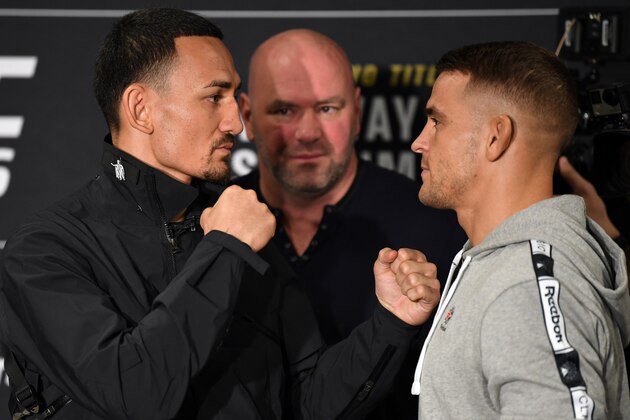 ATLANTA, GA - APRIL 11:  Max Holloway and Dustin Poirier face-off for the media during the UFC 236 Ultimate Media Day at Hyatt Regency Atlanta on April 11, 2019 in Atlanta, Georgia. (Photo by Josh Hedges/Zuffa LLC/Zuffa LLC via Getty Images)