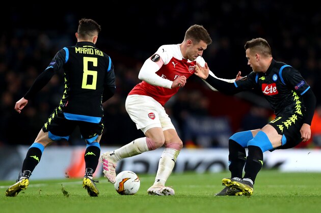 LONDON, ENGLAND - APRIL 11: Mario Rui of and Piotr Zielinski of SSC Napoli and Aaron Ramsey of Arsenal in action during the UEFA Europa League Quarter Final First Leg match between Arsenal FC and S.S.C Napoli at The Emirates Stadium on April 11, 2019 in London, England. (Photo by Chloe Knott - Danehouse/Getty Images)