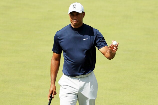 AUGUSTA, GEORGIA - APRIL 11: Tiger Woods of the United States waves on the 16th green during the first round of the Masters at Augusta National Golf Club on April 11, 2019 in Augusta, Georgia. (Photo by Mike Ehrmann/Getty Images)
