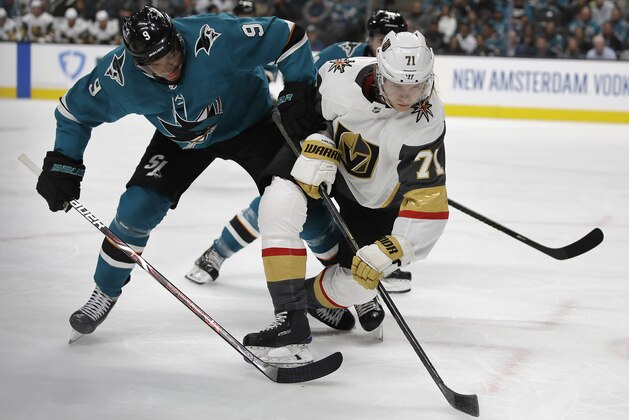 San Jose Sharks' Evander Kane, left, and Vegas Golden Knights' William Karlsson compete for the puck during the second period of Game 1 of an NHL hockey first-round playoff series Wednesday, April 10, 2019, in San Jose, Calif. (AP Photo/Ben Margot)