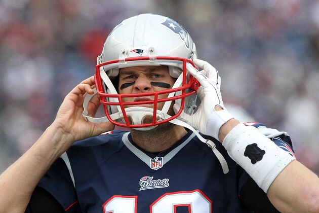 FOXBORO, MA - DECEMBER 28: Tom Brady #12 of the New England Patriots puts on his helmet against the Buffalo Bills during the first half at Gillette Stadium on December 28, 2014 in Foxboro, Massachusetts. (Photo by Jerome Davis/Getty Images)