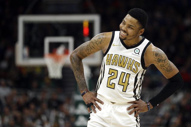 Atlanta Hawks' Kent Bazemore smiles during the second half of an NBA basketball game against the Milwaukee Bucks Sunday, April 7, 2019, in Milwaukee. (AP Photo/Aaron Gash)