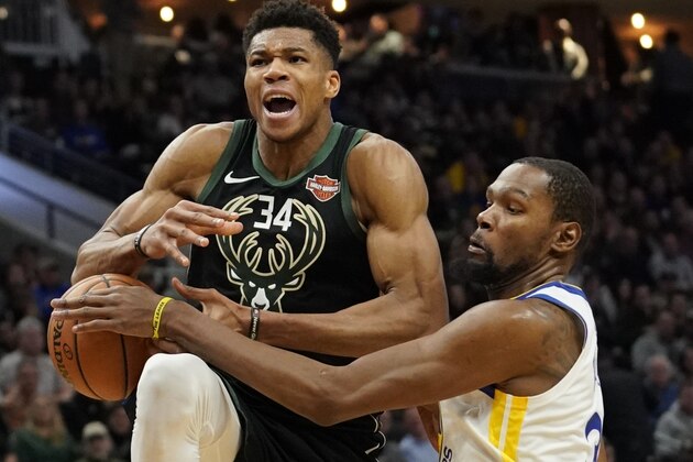 Golden State Warriors' Kevin Durant fouls Milwaukee Bucks' Giannis Antetokounmpo during the second half of an NBA basketball game Friday, Dec. 7, 2018, in Milwaukee. The Warriors won 105-95. (AP Photo/Morry Gash)