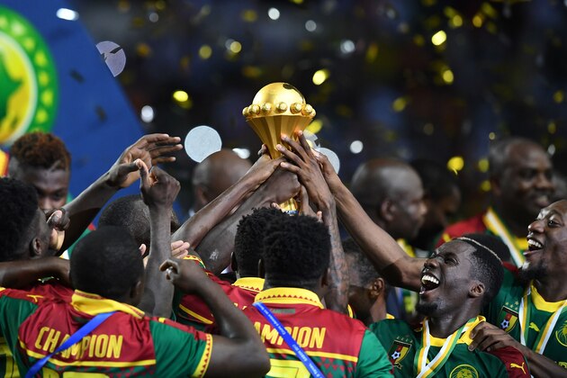 The Cameroon football team celebrate with the winner's trophy after beating Egypt 2-1 to win the 2017 Africa Cup of Nations final football match between Egypt and Cameroon at the Stade de l'Amitie Sino-Gabonaise in Libreville on February 5, 2017. / AFP / GABRIEL BOUYS        (Photo credit should read GABRIEL BOUYS/AFP/Getty Images)