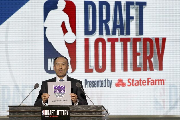 NBA Deputy Commissioner Mark Tatum announces that the Sacramento Kings had won the second pick during the NBA basketball draft lottery Tuesday, May 15, 2018, in Chicago. (AP Photo/Charles Rex Arbogast)