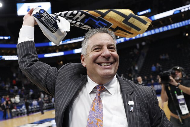 Auburn coach Bruce Pearl celebrates the team's win over Kansas in a second-round game in the NCAA men's college basketball tournament Saturday, March 23, 2019, in Salt Lake City. (AP Photo/Jeff Swinger)