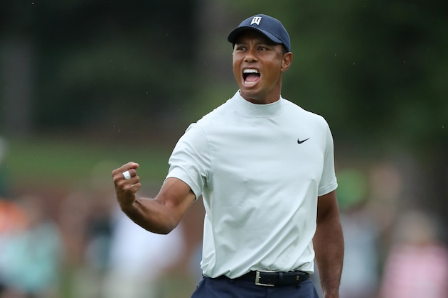 AUGUSTA, GEORGIA - APRIL 12: Tiger Woods of the United States celebrates after making a putt for birdie on the 15th green during the second round of the Masters at Augusta National Golf Club on April 12, 2019 in Augusta, Georgia. (Photo by David Cannon/Getty Images)