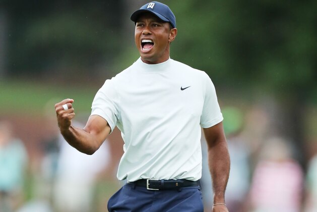 AUGUSTA, GEORGIA - APRIL 12: Tiger Woods of the United States celebrates after making a putt for birdie on the 15th green during the second round of the Masters at Augusta National Golf Club on April 12, 2019 in Augusta, Georgia. (Photo by David Cannon/Getty Images)