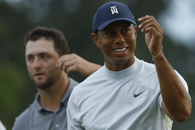 Tiger Woods smiles as he walks off the 18th green during the second round for the Masters golf tournament Friday, April 12, 2019, in Augusta, Ga. (AP Photo/Matt Slocum)