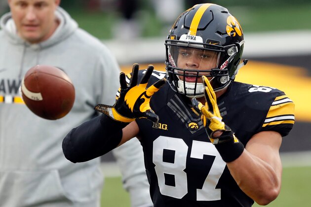 FILE - In this April 20, 2018, file photo, Iowa tight end Noah Fant catches a pass during a drill before the team's NCAA college football spring scrimmage, in Iowa City, Iowa. Despite setting records last fall, Iowa tight end Noah Fant went largely unnoticed outside of the Big Ten West. That shouldn’t be the case in 2018. Fant will return for his junior season with the Hawkeyes as one of the nation’s most intriguing pro prospects. (AP Photo/Charlie Neibergall, File)