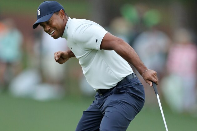 AUGUSTA, GEORGIA - APRIL 12: Tiger Woods of the United States celebrates after making a putt for birdie on the 15th green during the second round of the Masters at Augusta National Golf Club on April 12, 2019 in Augusta, Georgia. (Photo by David Cannon/Getty Images)