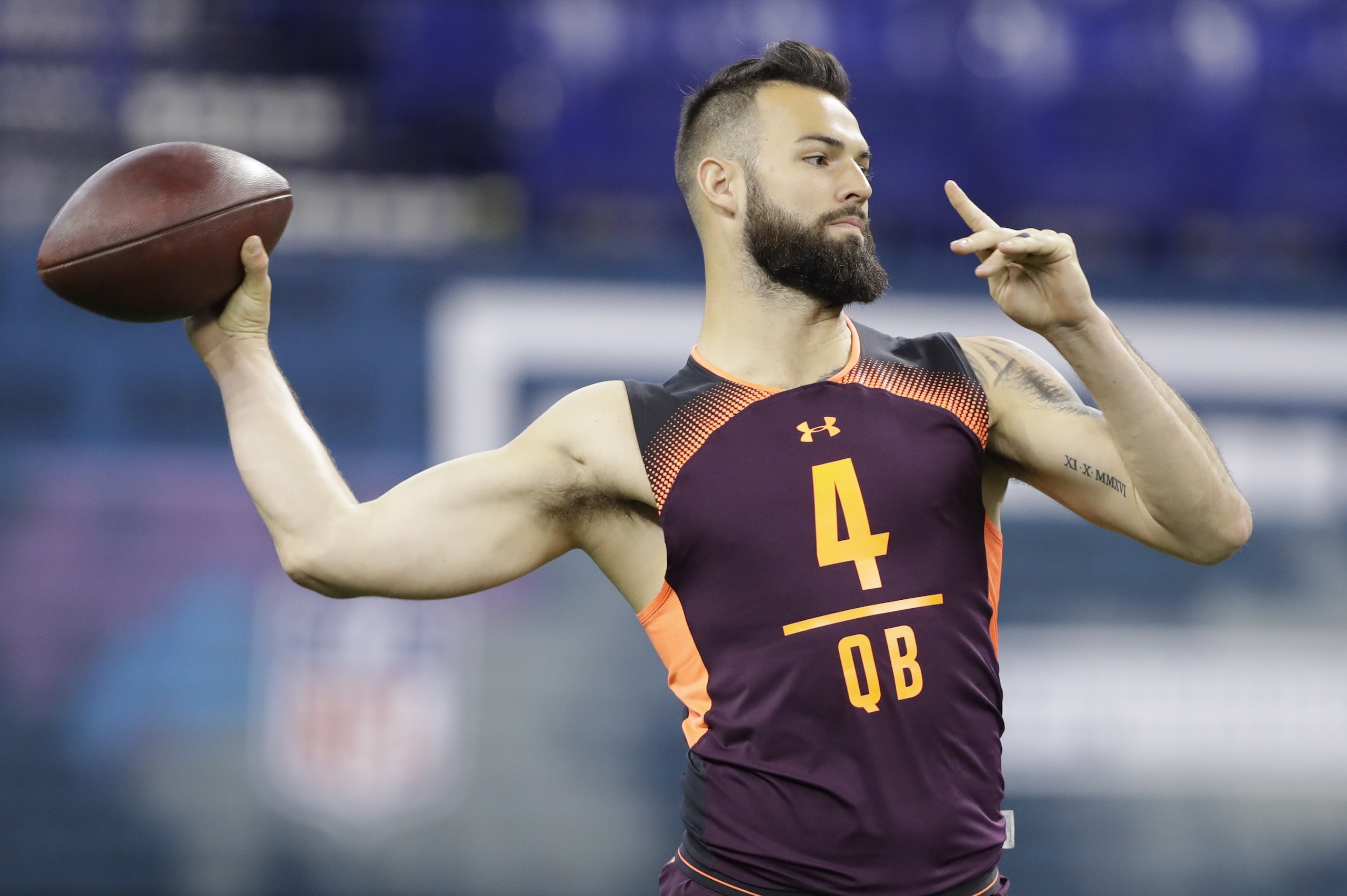 West Virginia quarterback Will Grier runs a drill during the NFL football scouting combine, Saturday, March 2, 2019, in Indianapolis. (AP Photo/Darron Cummings)