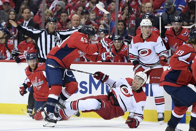 Washington Capitals right wing Tom Wilson (43) checks Carolina Hurricanes center Jordan Staal (11) during the first period of Game 1 of an NHL hockey first-round playoff series Thursday, April 11, 2019, in Washington. (AP Photo/Nick Wass)